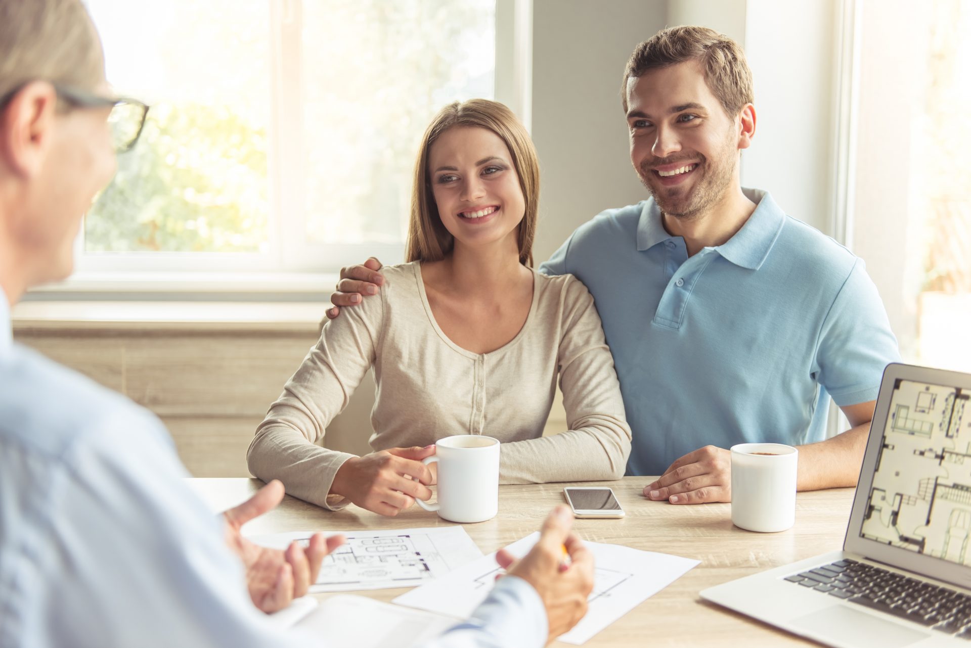 Couple visiting realtor